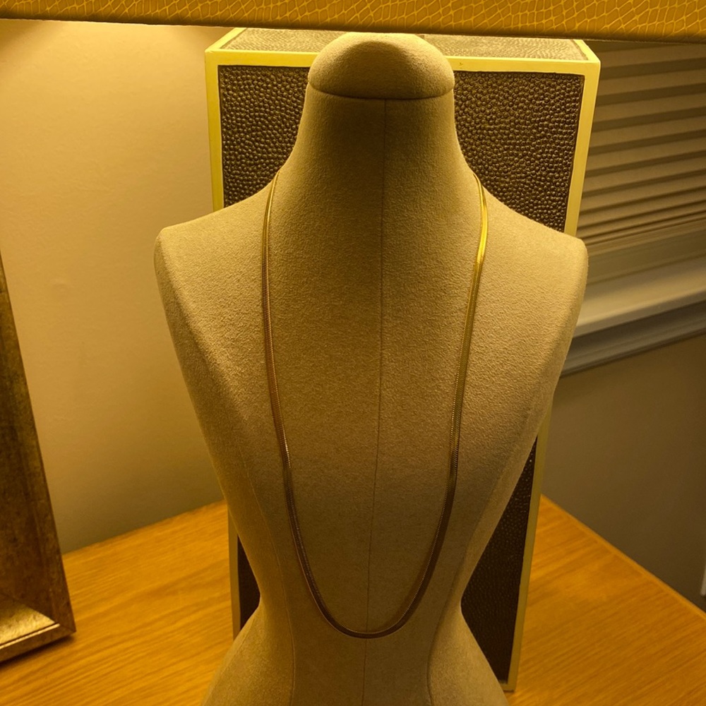 Gold tone herringbone necklace with an extender